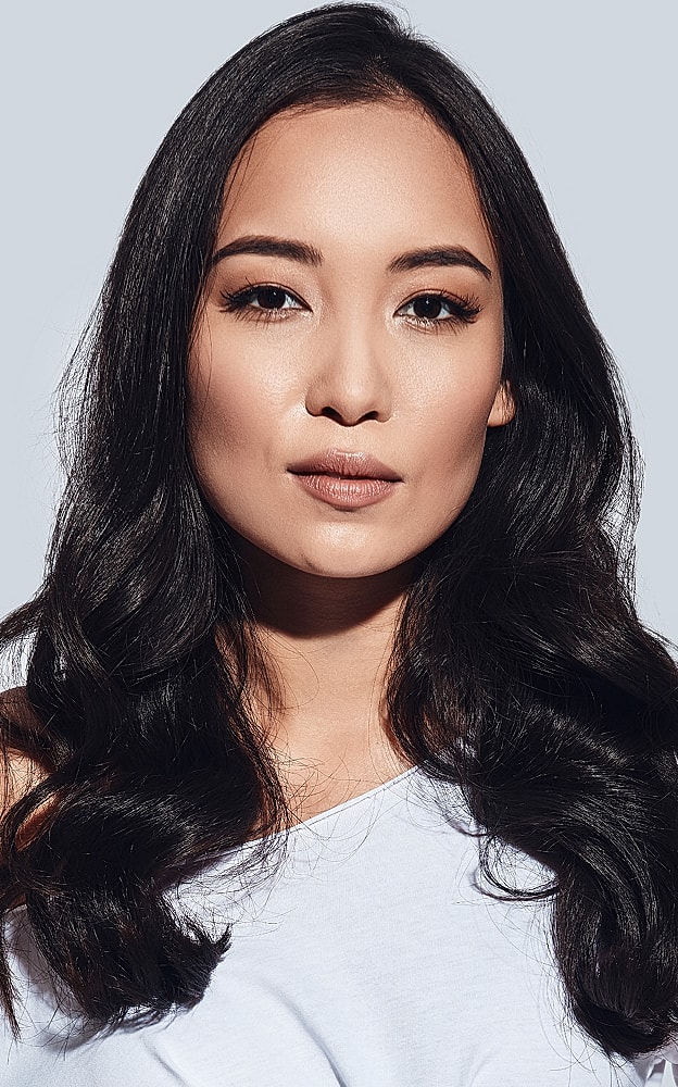 Portrait of a woman with long, dark hair.