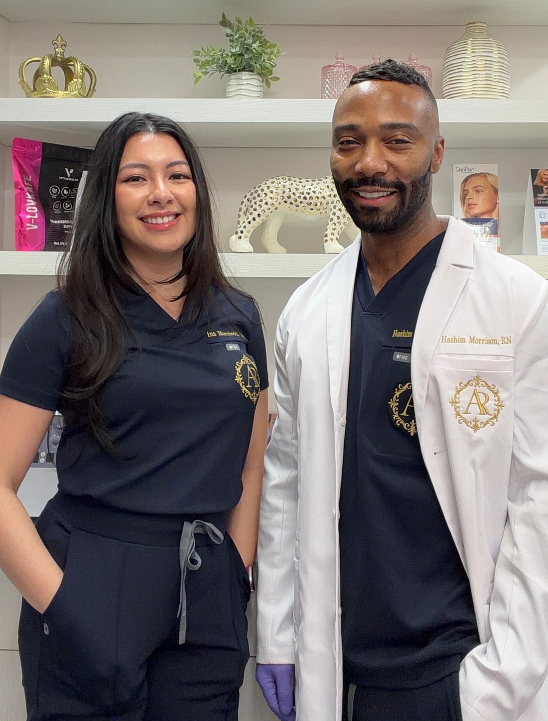 Healthcare professionals posing in a clinical setting.