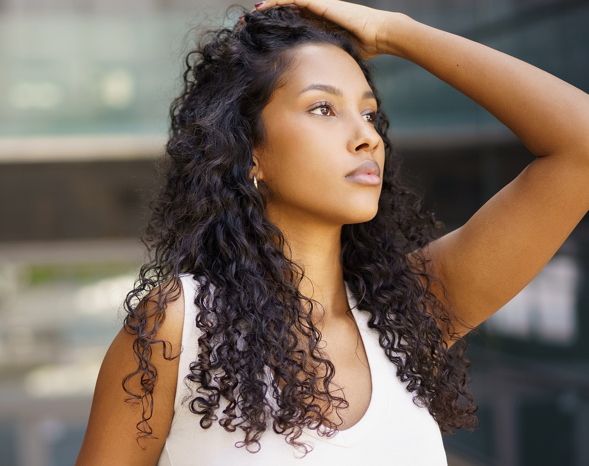 Profile of a woman with curly hair.